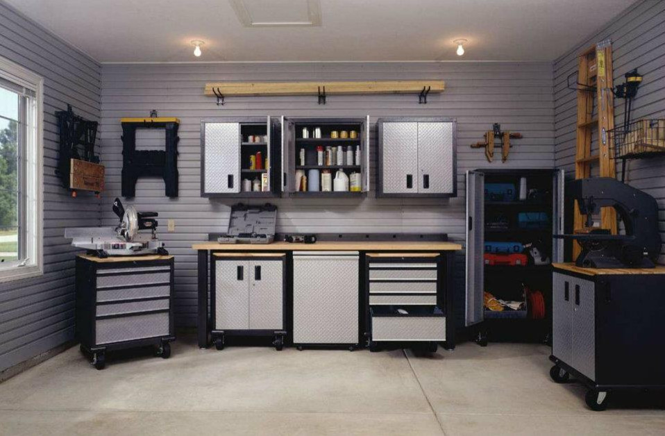 Mid-sized urban attached two-car garage workshop photo in Toronto