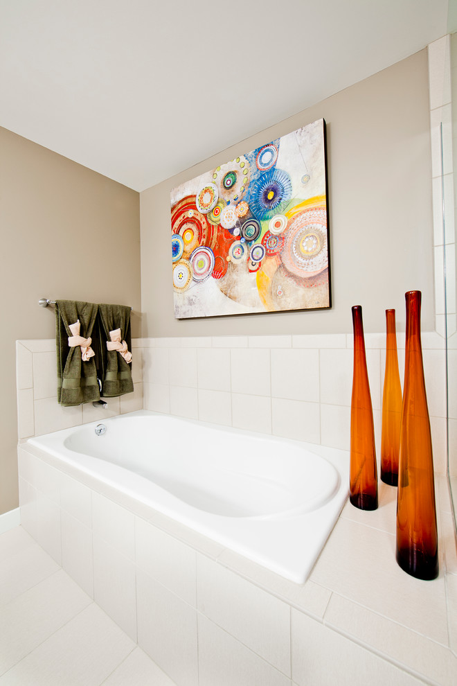 This is an example of a contemporary bathroom in Omaha with an alcove tub.