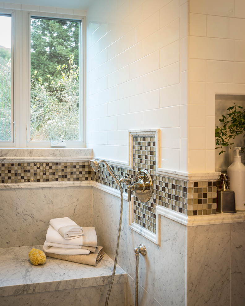 Photo of a traditional master bathroom in San Francisco with beaded inset cabinets and glass tile.