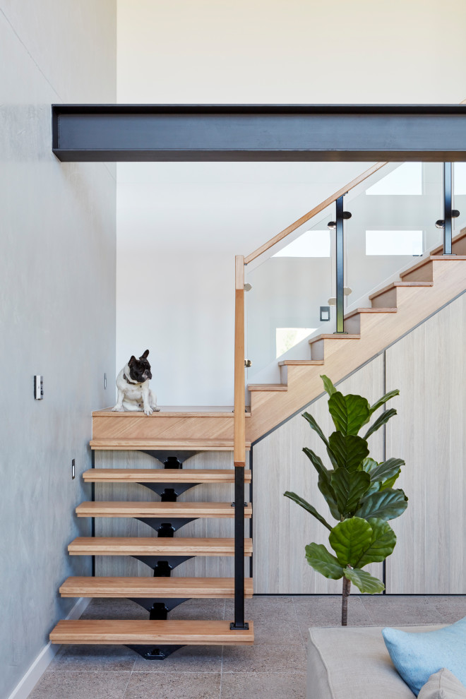 Design ideas for a contemporary wood l-shaped staircase in Melbourne with open risers and mixed railing.
