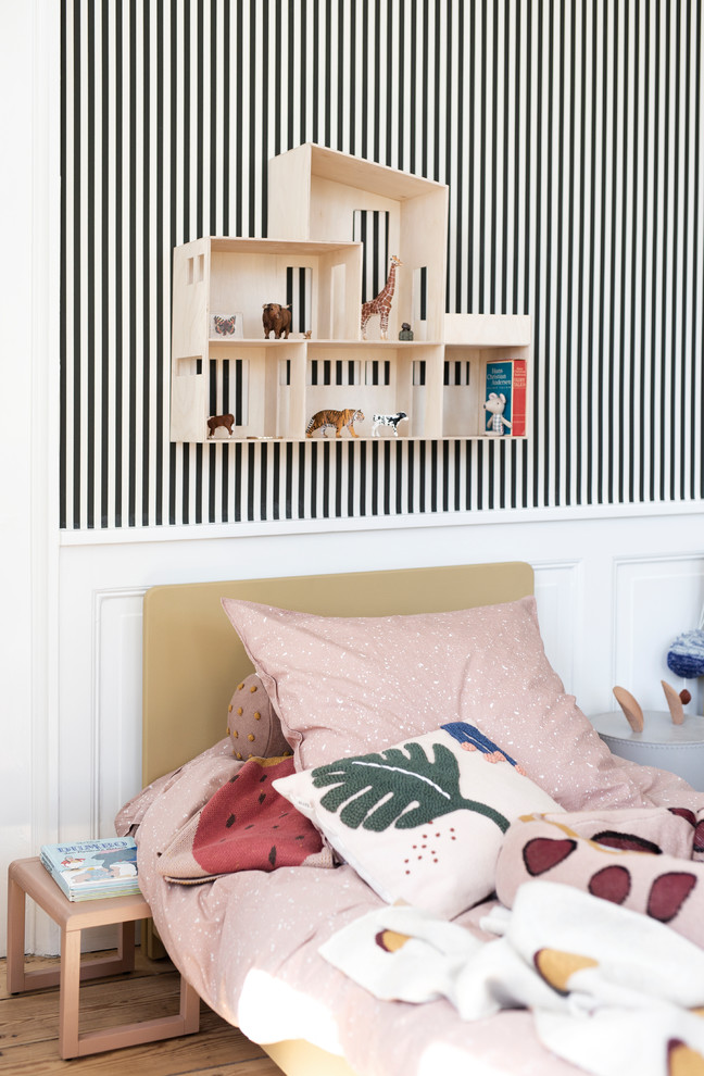 Inspiration for a scandinavian kids' bedroom in Melbourne with white walls, medium hardwood floors and brown floor.