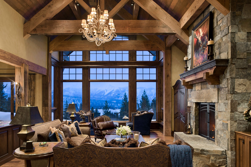 Design ideas for an expansive country living room in Other with a standard fireplace and a stone fireplace surround.
