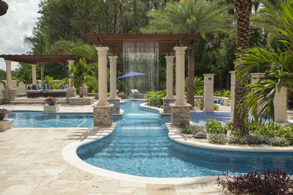 Design ideas for a mediterranean backyard custom-shaped pool in Tampa with a water feature.
