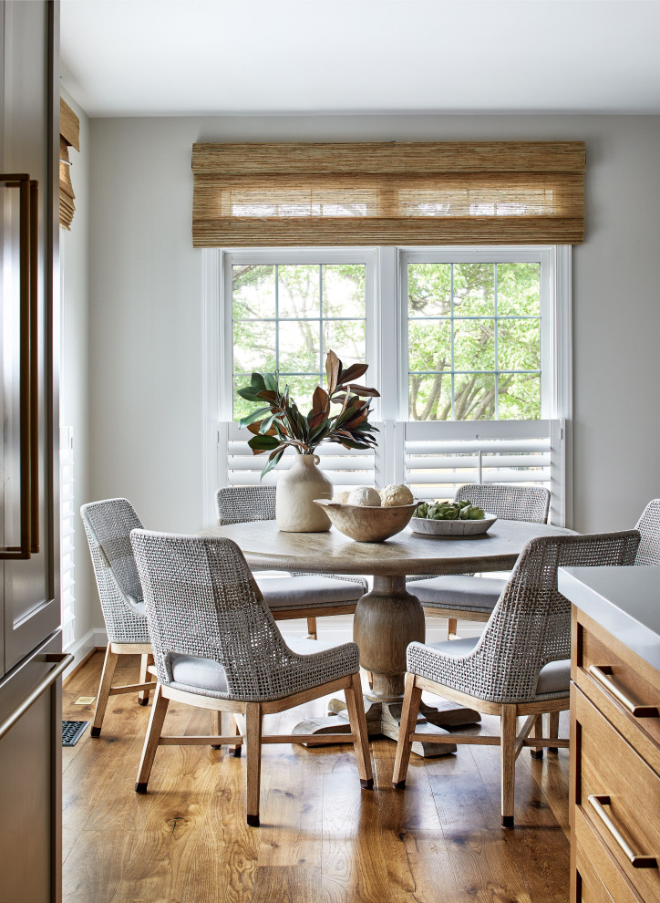 Mid-sized transitional l-shaped light wood floor enclosed kitchen photo in DC Metro with shaker cabinets, light wood cabinets, quartz countertops, an island and white countertops