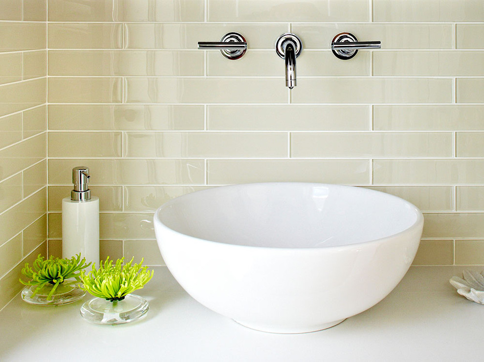 Inspiration for a small contemporary white tile and glass tile bathroom remodel in San Francisco with a vessel sink, flat-panel cabinets, medium tone wood cabinets, quartz countertops and a wall-mount toilet