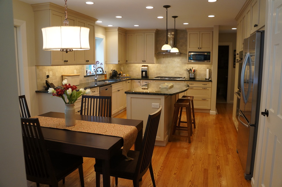Eat-in kitchen - transitional eat-in kitchen idea in Boston with an undermount sink, recessed-panel cabinets, white cabinets, granite countertops and an island