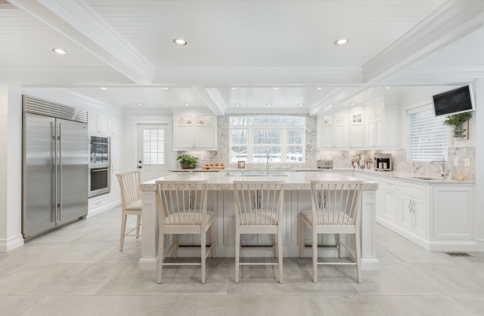 Transitional l-shaped ceramic tile and gray floor eat-in kitchen photo with an undermount sink, beaded inset cabinets, white cabinets, quartz countertops, multicolored backsplash, quartz backsplash, stainless steel appliances, an island and multicolored countertops