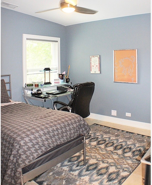 Photo of a mid-sized contemporary bedroom in Chicago with grey walls, beige floor and porcelain floors.