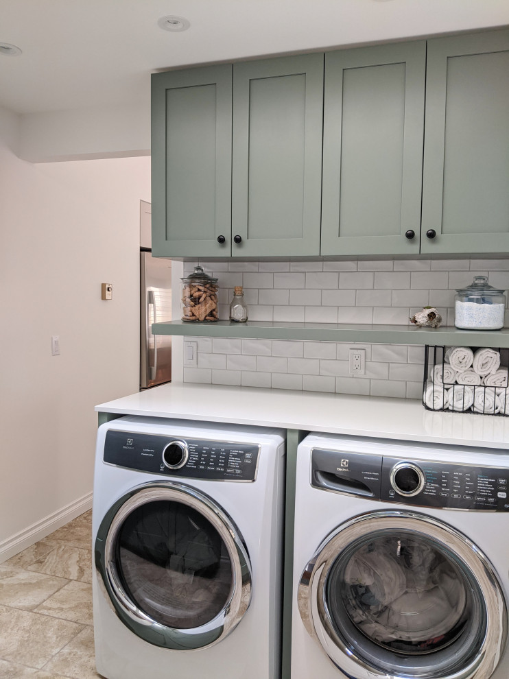 Inspiration for a mid-sized transitional u-shaped laundry room in Vancouver with an undermount sink, shaker cabinets, beige cabinets, quartz benchtops, white splashback, porcelain splashback, ceramic floors, beige floor, white benchtop and vaulted.