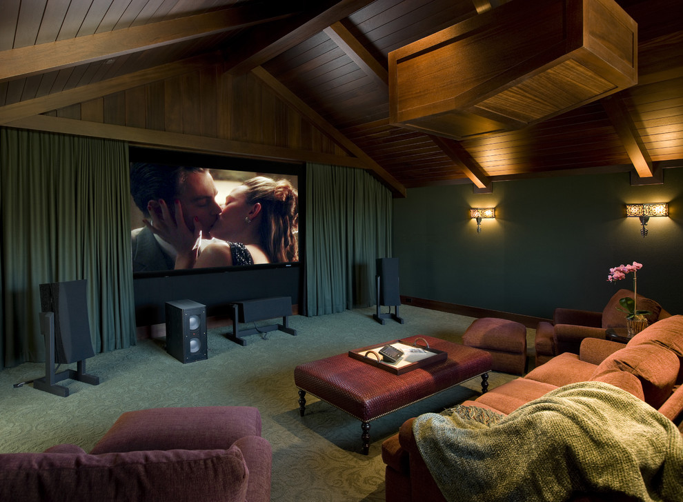 Inspiration for a mid-sized beach style enclosed home theatre in Santa Barbara with green walls, carpet, a projector screen and green floor.