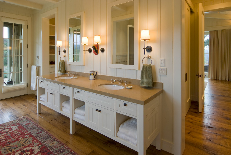 Inspiration for a large country master bathroom in San Francisco with louvered cabinets, white cabinets, white walls, medium hardwood floors, an undermount sink, solid surface benchtops, white tile, an undermount tub, an alcove shower, a two-piece toilet and subway tile.