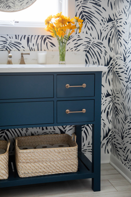 Powder room - mid-sized eclectic porcelain tile, brown floor and wallpaper powder room idea in Milwaukee with flat-panel cabinets, blue cabinets, a two-piece toilet, blue walls, an undermount sink, quartz countertops, white countertops and a freestanding vanity
