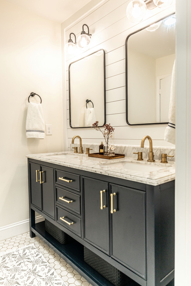 Small country master bathroom in Baltimore with beaded inset cabinets, blue cabinets, an alcove tub, an alcove shower, a two-piece toilet, white tile, ceramic tile, white walls, a drop-in sink, marble benchtops, a shower curtain, white benchtops, a double vanity and a freestanding vanity.