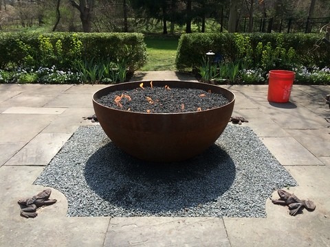 Mid-sized traditional backyard patio in Chicago with a fire feature, natural stone pavers and no cover.