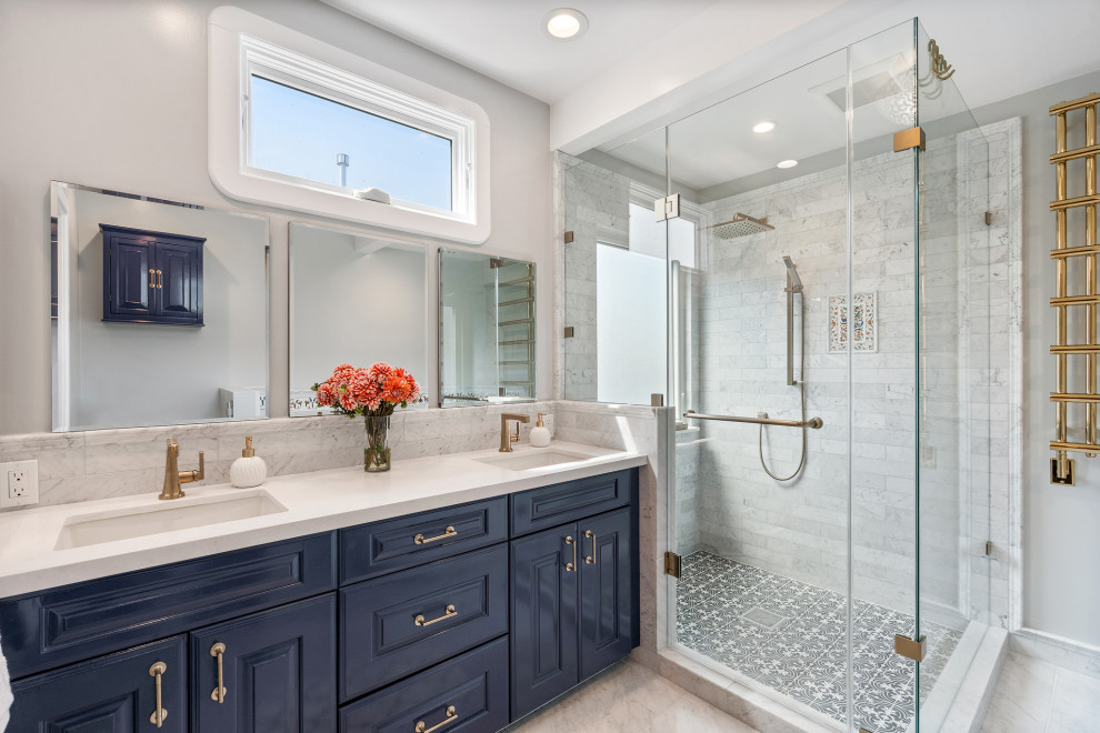 Example of a mid-sized transitional master white tile and ceramic tile ceramic tile, white floor and double-sink freestanding bathtub design in San Francisco with raised-panel cabinets, blue cabinets, a two-piece toilet, white walls, an undermount sink, quartz countertops, a hinged shower door, white countertops and a built-in vanity