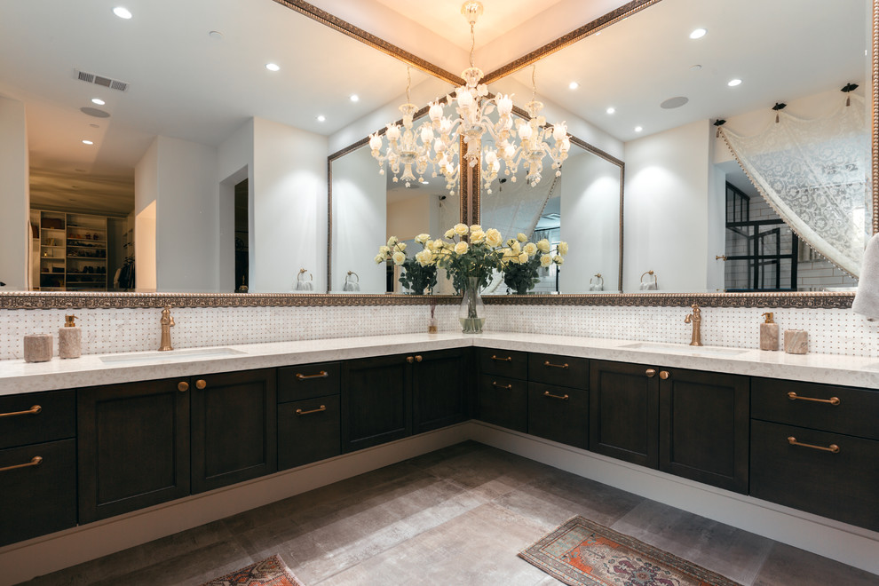 Traditional master bathroom in Los Angeles with recessed-panel cabinets, dark wood cabinets, white tile, cement tiles, an undermount sink, grey floor and beige benchtops.