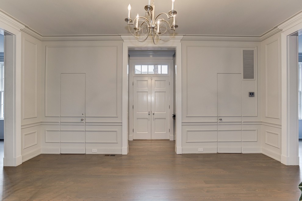 Inspiration for a huge transitional light wood floor foyer remodel in DC Metro with white walls and a white front door