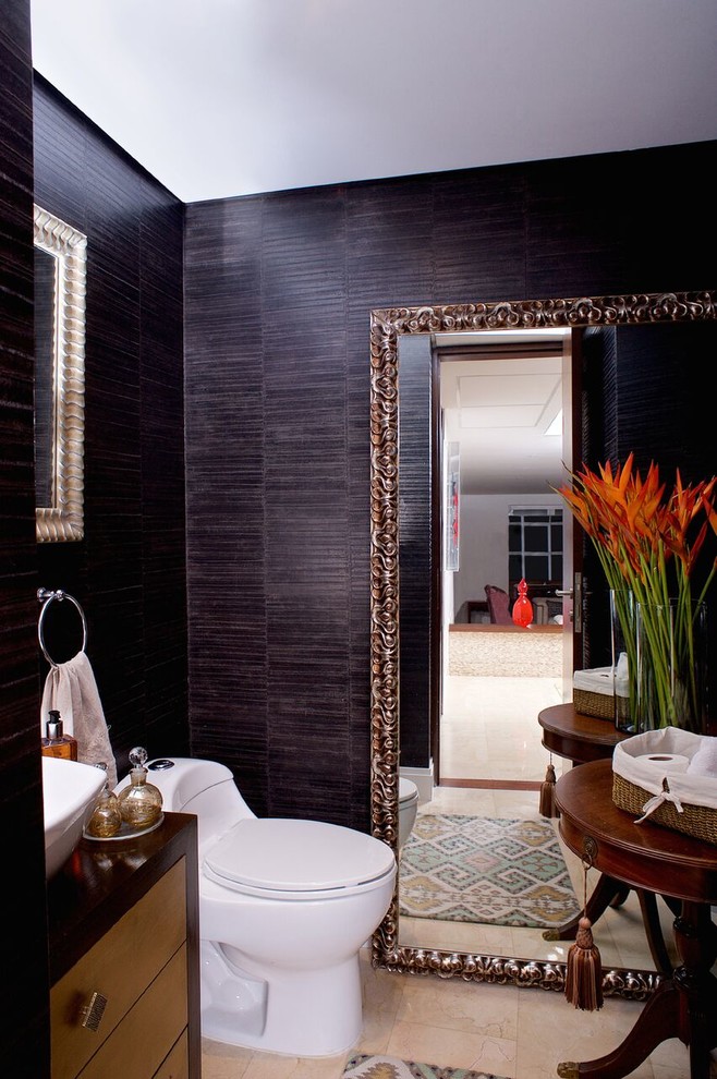 Inspiration for a mid-sized contemporary powder room in Other with a one-piece toilet, white tile, marble, black walls, marble floors, a vessel sink, wood benchtops, beige floor and brown benchtops.