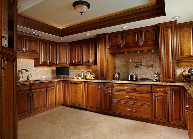 This is an example of a traditional eat-in kitchen in Jacksonville with beige cabinets and beige splashback.
