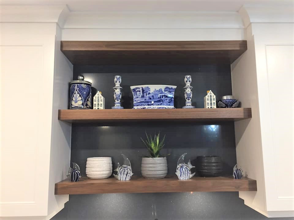 Eat-in kitchen - mid-sized transitional l-shaped dark wood floor and brown floor eat-in kitchen idea in Ottawa with an undermount sink, recessed-panel cabinets, white cabinets, quartz countertops, blue backsplash, quartz backsplash, stainless steel appliances, an island and white countertops