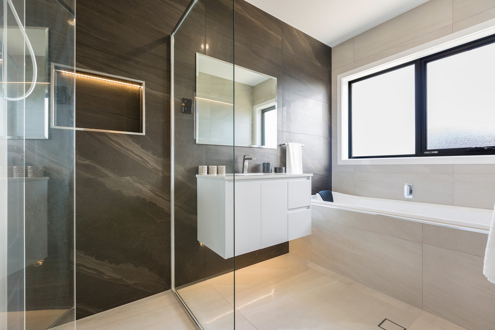 Design ideas for a mid-sized contemporary master bathroom in Canberra - Queanbeyan with white cabinets, a corner shower, a one-piece toilet, brown tile, cement tile, white walls, cement tiles, a drop-in sink, granite benchtops, brown floor and a hinged shower door.