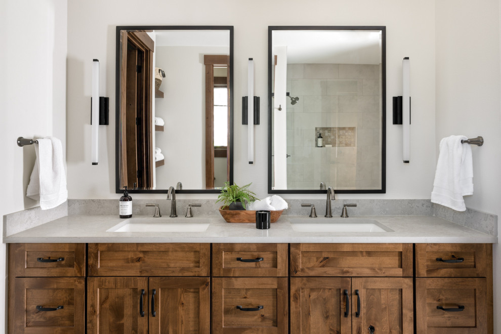 Photo of a mid-sized country master wet room bathroom in Seattle with shaker cabinets, medium wood cabinets, beige walls, marble floors, an undermount sink, marble benchtops, a hinged shower door, grey benchtops, a double vanity, a built-in vanity and recessed.