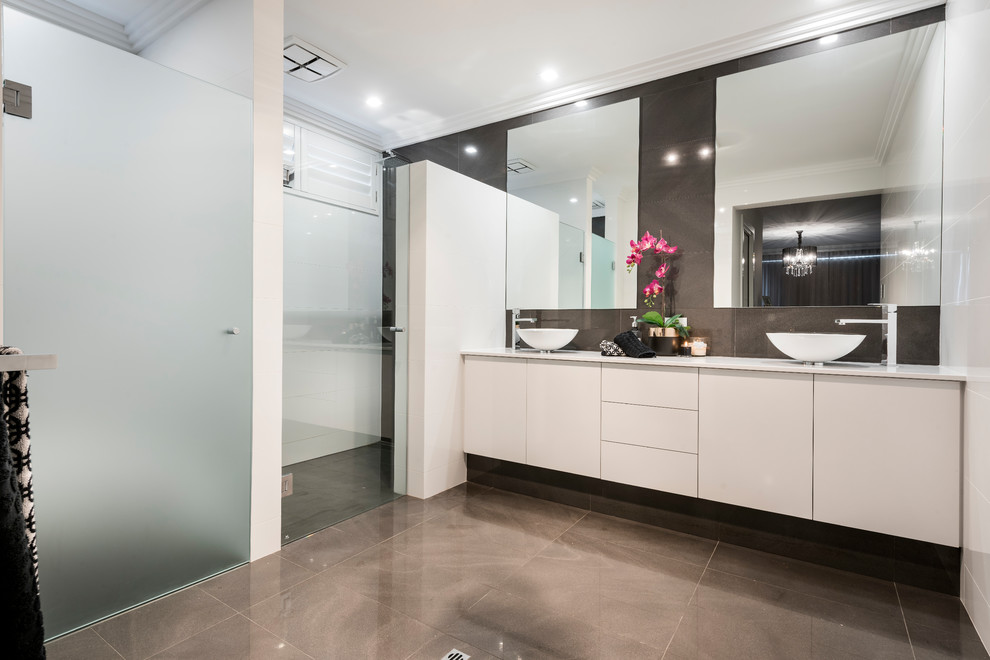 Contemporary bathroom in Perth with flat-panel cabinets, white cabinets, white tile, a vessel sink, grey floor and white benchtops.