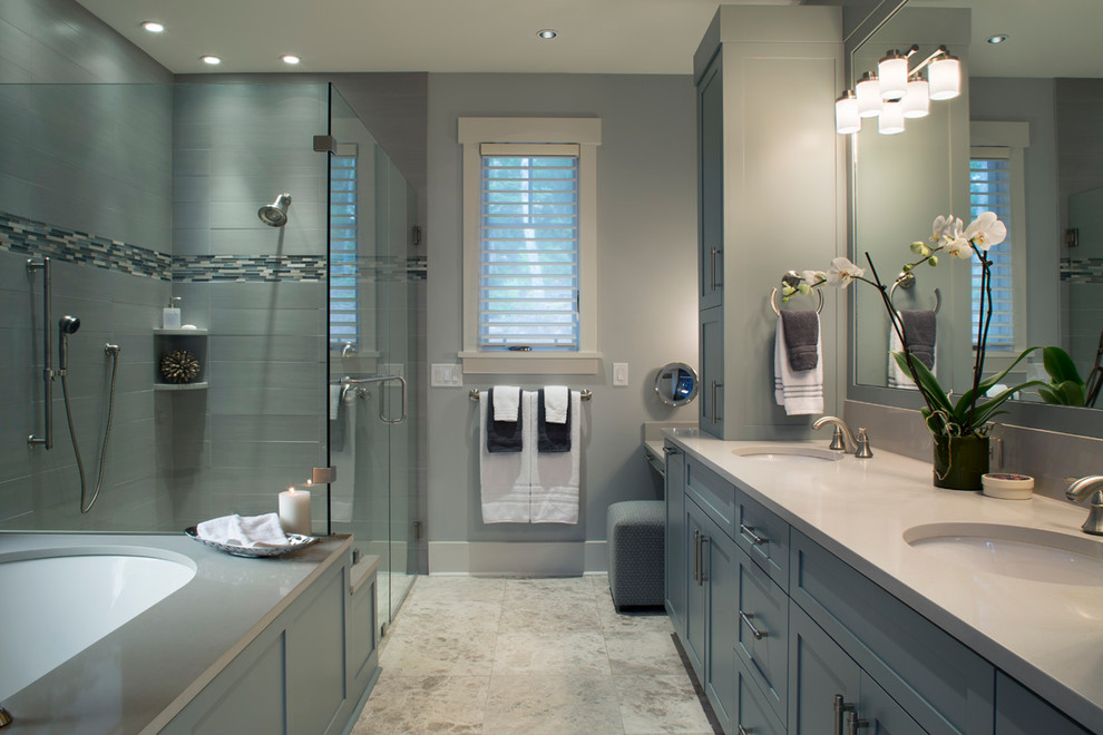 Inspiration for a transitional master bathroom in Other with an undermount sink, shaker cabinets, blue cabinets, engineered quartz benchtops, an undermount tub, a curbless shower, a one-piece toilet, gray tile, stone tile, grey walls and marble floors.