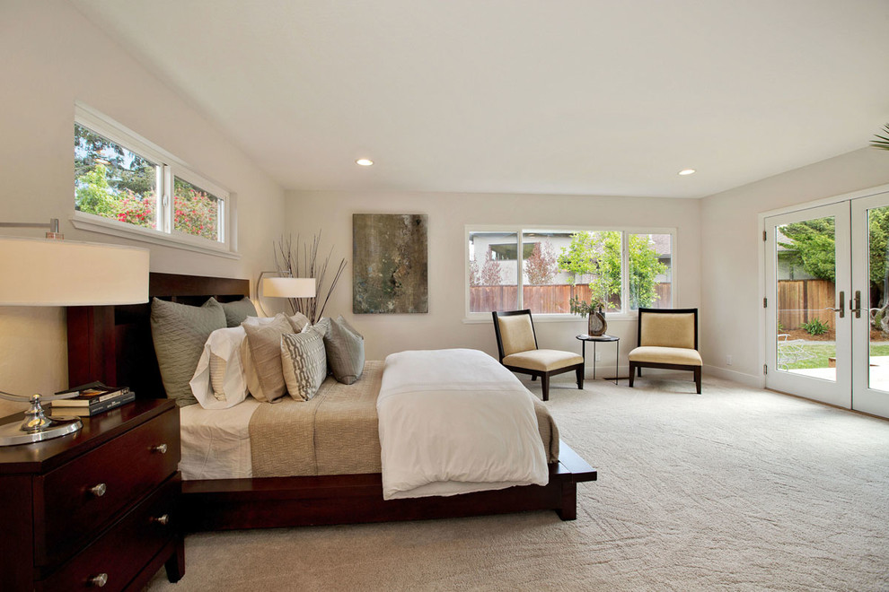 Large contemporary master bedroom in San Francisco with white walls, carpet and no fireplace.