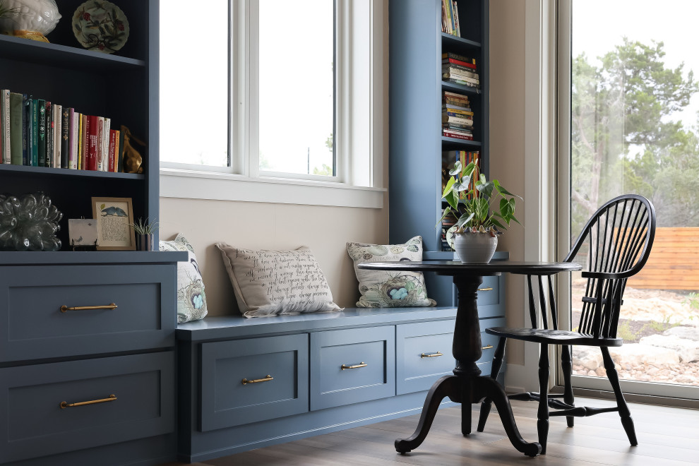 Country light wood floor breakfast nook photo in Austin