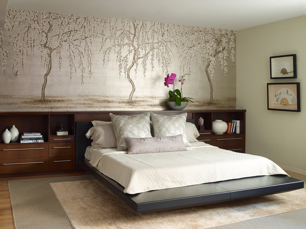 Inspiration for an asian master bedroom in New York with green walls, light hardwood floors and beige floor.