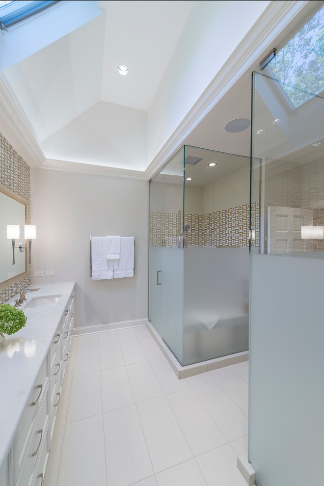 This is an example of a mid-sized traditional master bathroom in Chicago with beaded inset cabinets, light wood cabinets, an integrated sink, white walls, porcelain floors, engineered quartz benchtops, a one-piece toilet, white tile, porcelain tile and a corner shower.