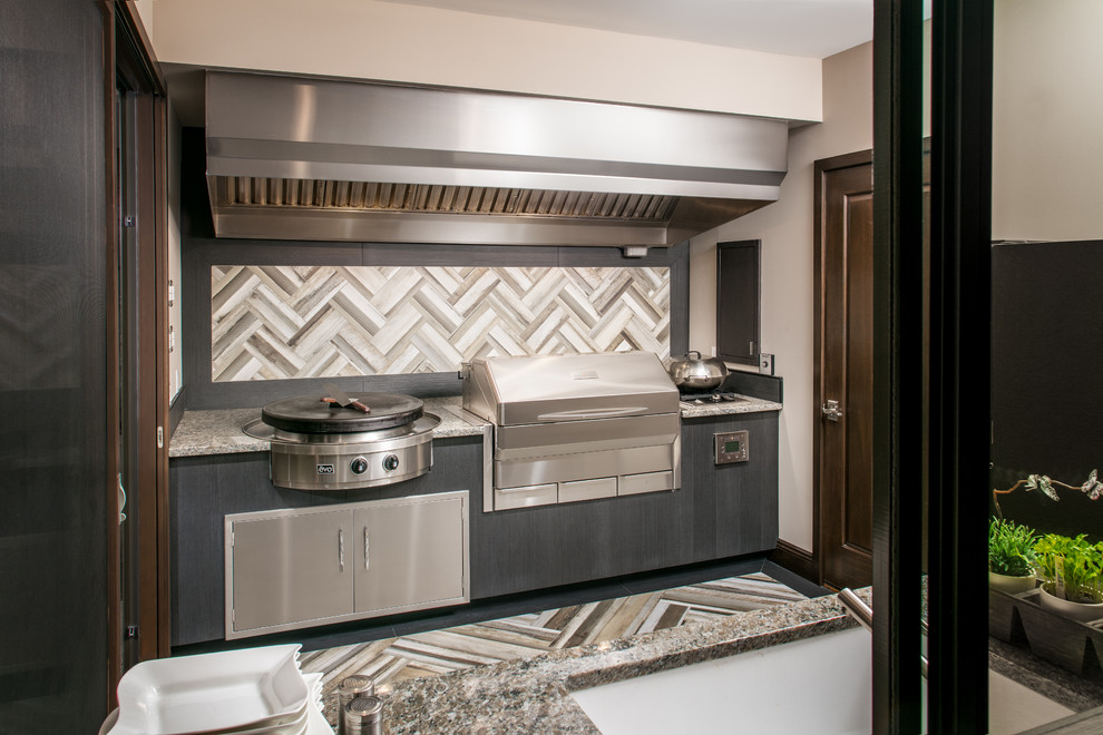 Mid-sized transitional backyard patio kitchen photo in Omaha with a roof extension