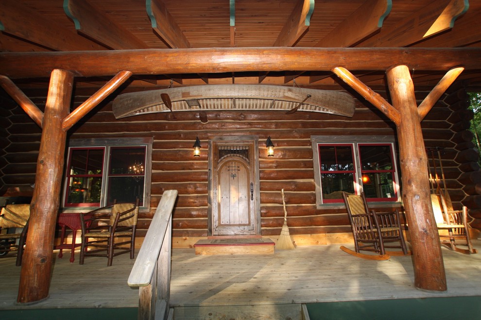 Large mountain style brown two-story wood exterior home photo