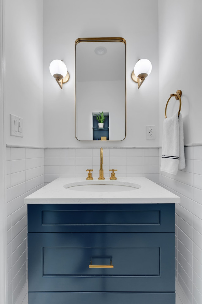 Photo of a small retro bathroom in Los Angeles with blue cabinets, white tiles, metro tiles, white walls, marble worktops, white worktops and a single sink.