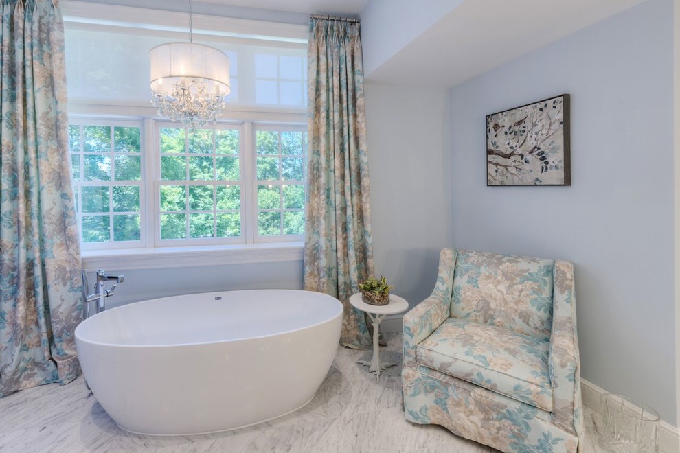 Example of a large transitional master blue tile and glass tile marble floor freestanding bathtub design in Boston with flat-panel cabinets, white cabinets, white walls, an undermount sink and quartz countertops
