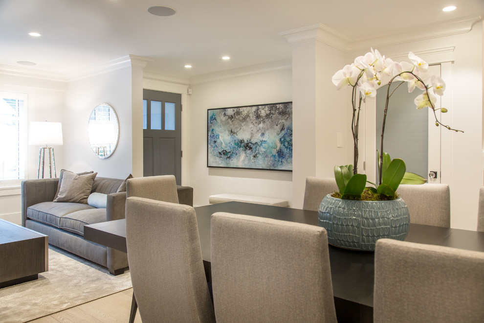 Example of a small transitional medium tone wood floor and beige floor foyer design in Vancouver with gray walls and a gray front door