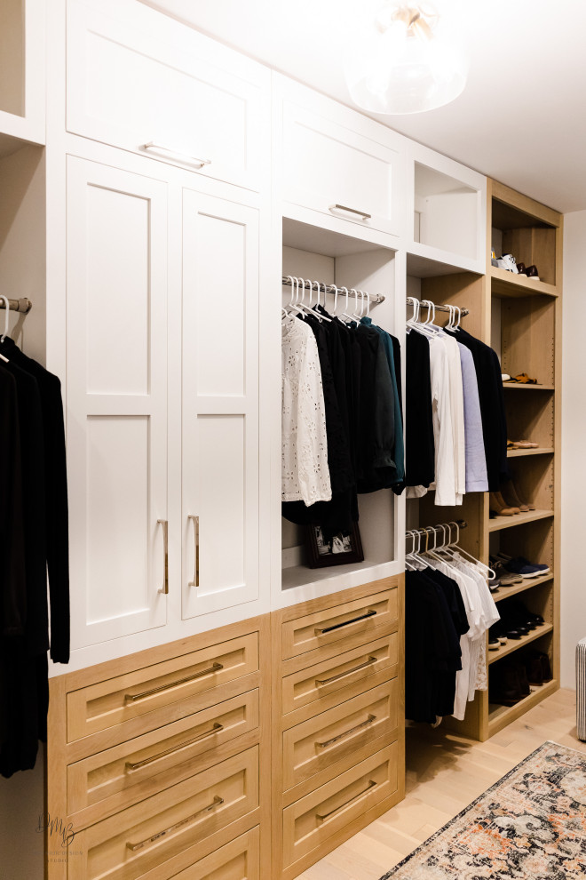Transitional walk-in wardrobe in Other with flat-panel cabinets, light wood cabinets, light hardwood floors and white floor.