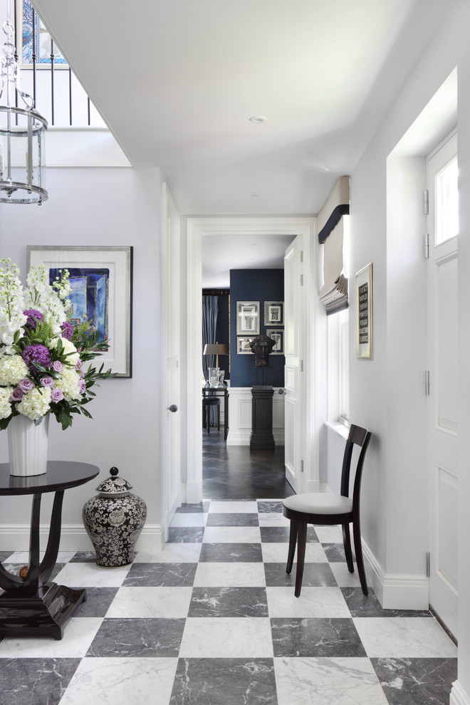 Large traditional hallway in London with grey walls, marble floors and multi-coloured floor.