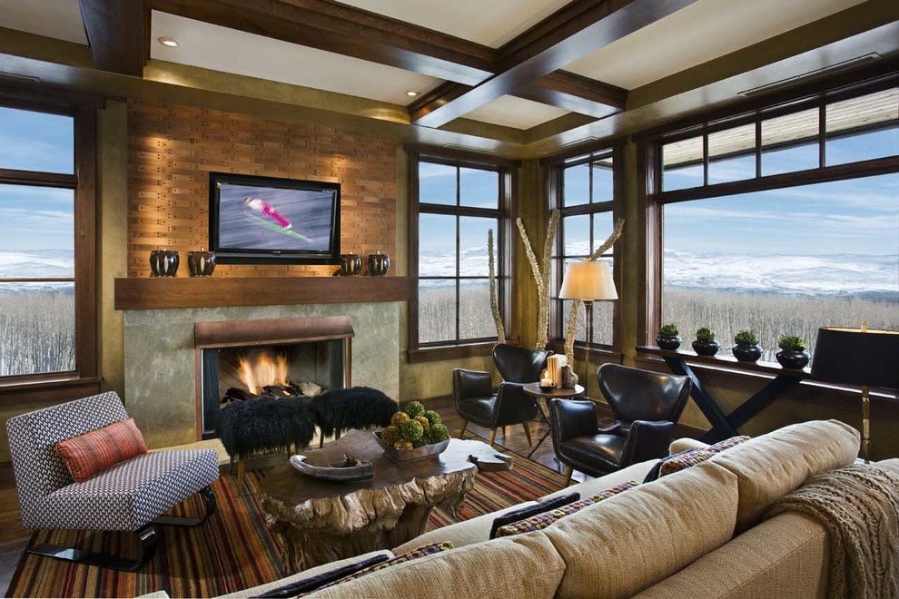 Photo of a large midcentury open concept living room in Denver with beige walls, dark hardwood floors, a standard fireplace, a metal fireplace surround and a wall-mounted tv.