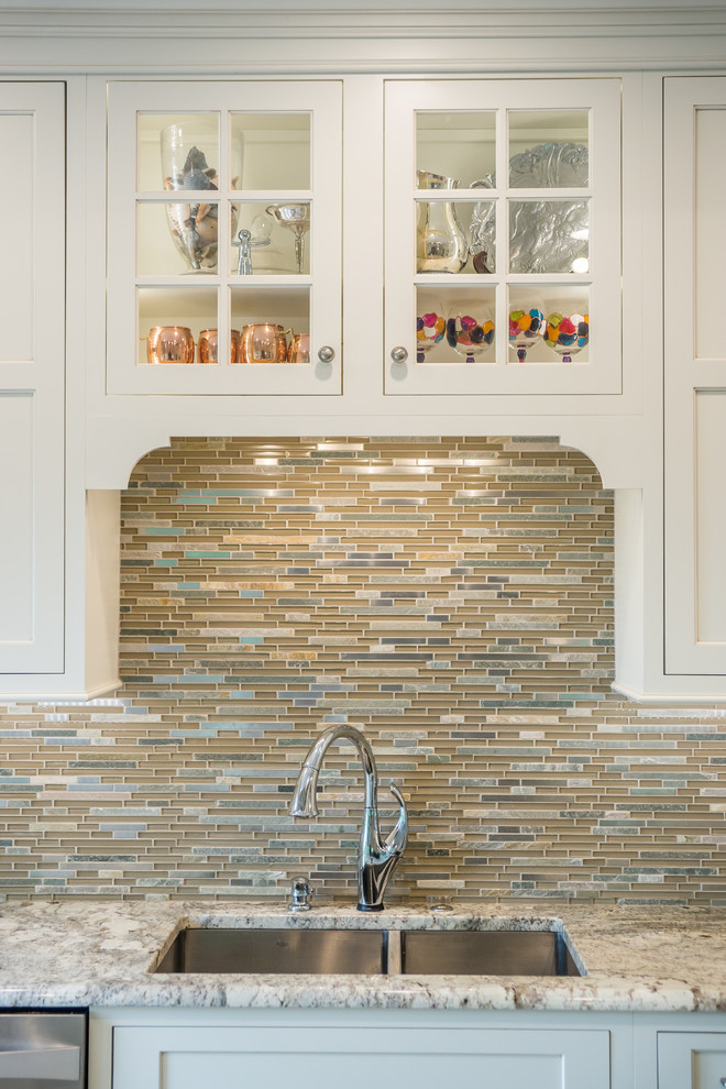 Example of a huge transitional l-shaped medium tone wood floor eat-in kitchen design in Birmingham with an undermount sink, recessed-panel cabinets, white cabinets, granite countertops, multicolored backsplash, glass tile backsplash, stainless steel appliances and an island