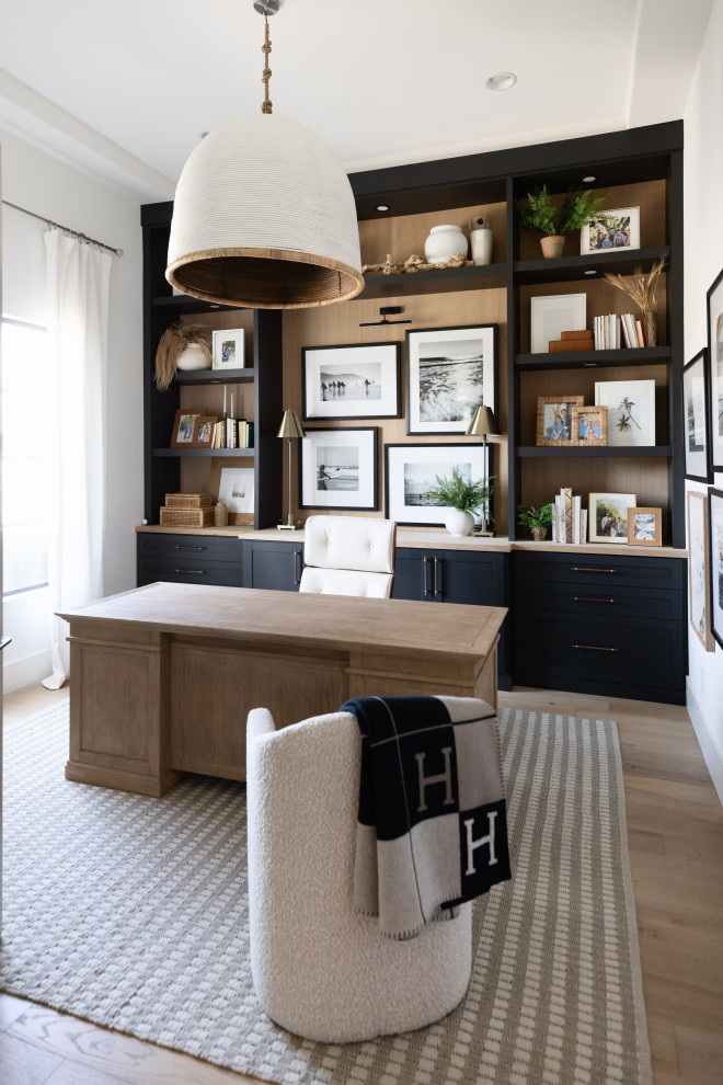 Study room - mid-sized coastal built-in desk coffered ceiling study room idea in Phoenix with white walls