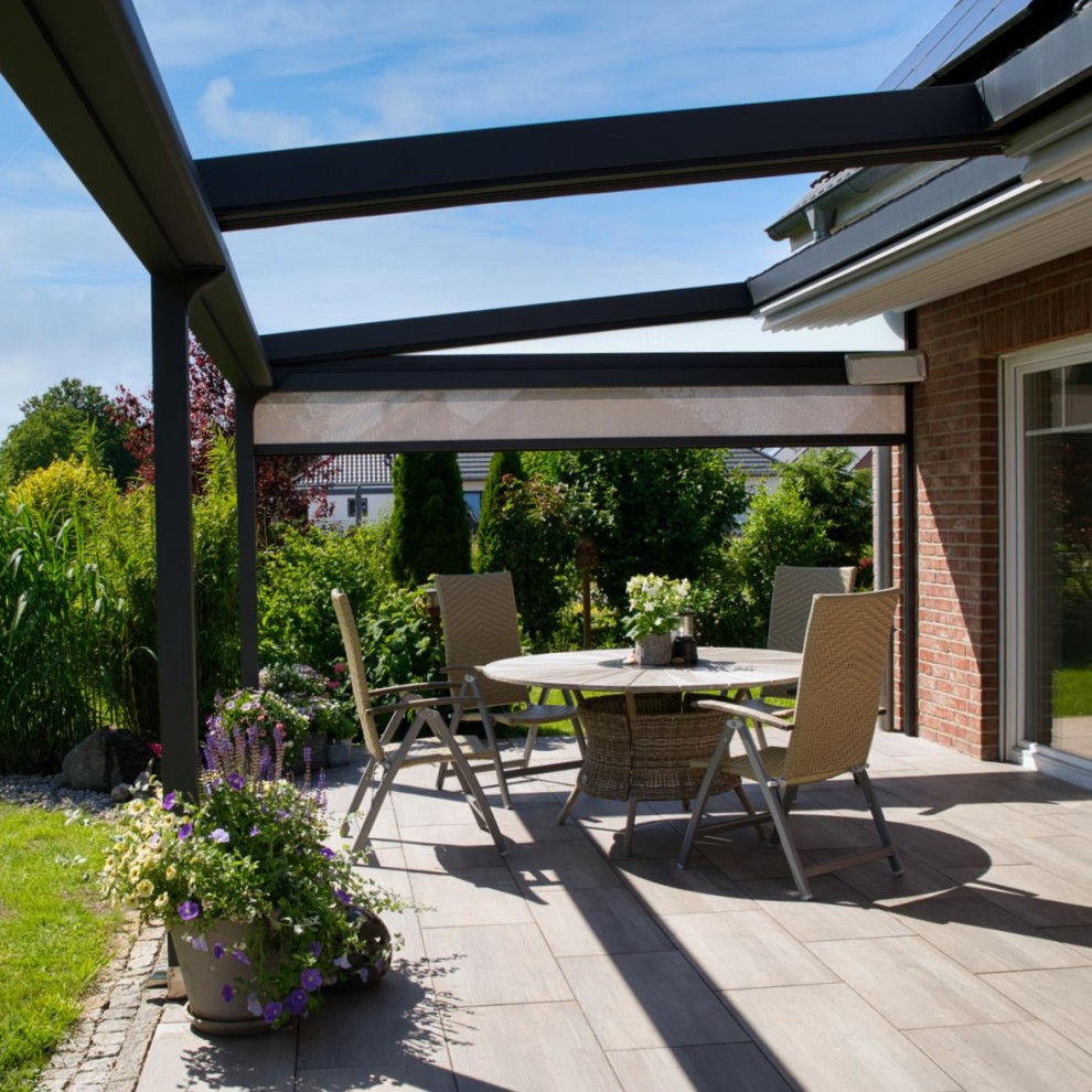 Inspiration for a mid-sized contemporary side yard and ground level deck in Hanover with with privacy feature and a pergola.