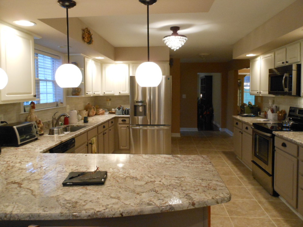 Mid-sized transitional u-shaped porcelain tile eat-in kitchen photo in DC Metro with raised-panel cabinets, gray cabinets, granite countertops, gray backsplash, no island, an undermount sink, subway tile backsplash and stainless steel appliances