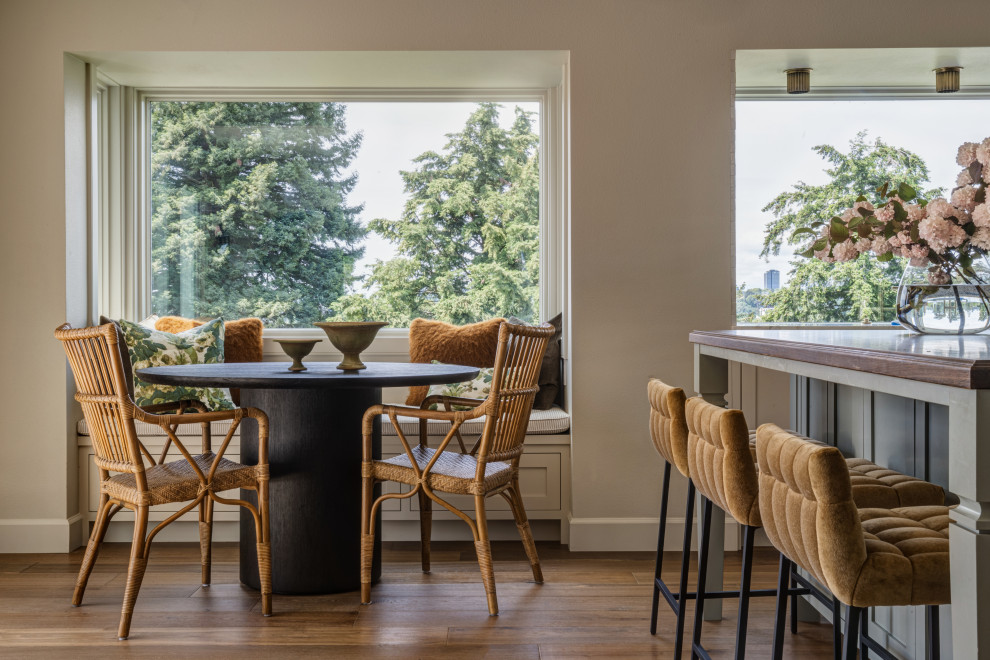 Inspiration for a small timeless medium tone wood floor and brown floor breakfast nook remodel in Seattle with beige walls and no fireplace