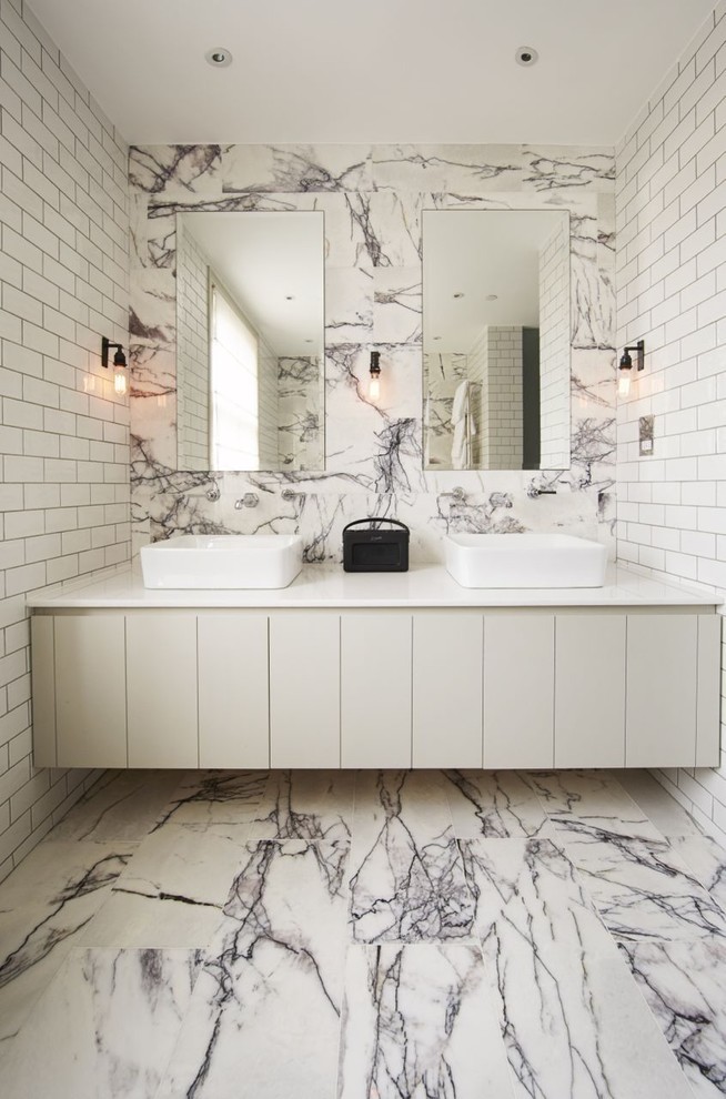 Design ideas for a contemporary bathroom in Other with flat-panel cabinets, grey cabinets, white walls, a vessel sink, multi-coloured floor and white benchtops.