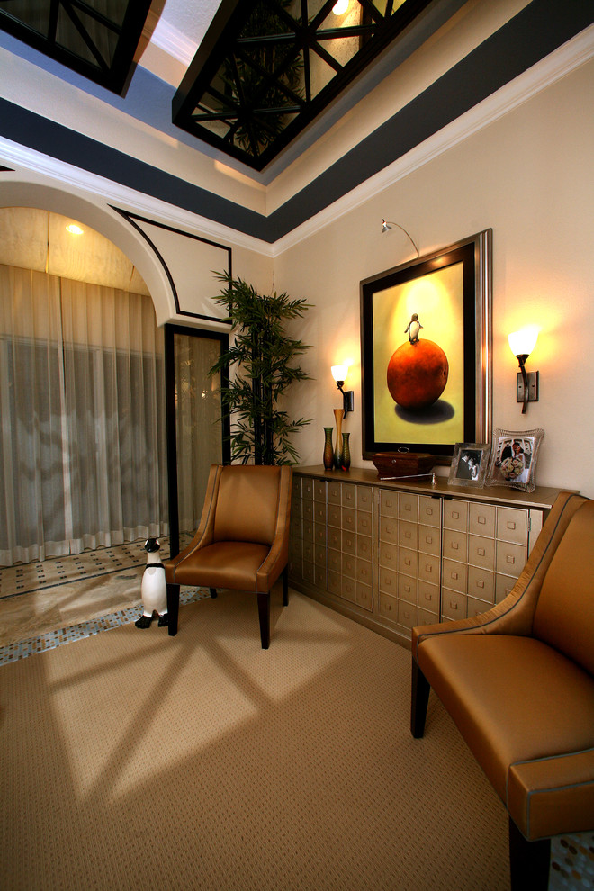This is an example of a large contemporary hallway in Tampa with beige walls and carpet.