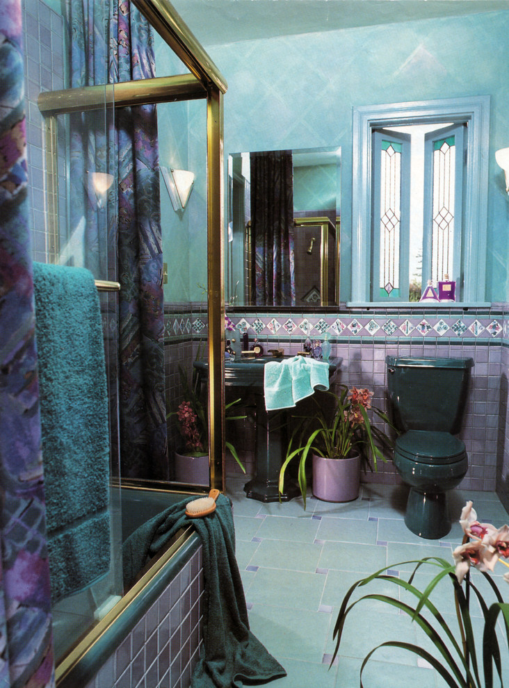 Large eclectic 3/4 bathroom in San Diego with an alcove tub, a shower/bathtub combo, a two-piece toilet, blue tile, multi-coloured tile, pink tile, ceramic tile, blue walls, porcelain floors, a pedestal sink, blue floor and a sliding shower screen.