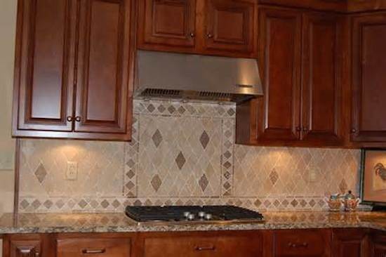 Example of a transitional kitchen design in Austin with beaded inset cabinets, medium tone wood cabinets, beige backsplash and stainless steel appliances