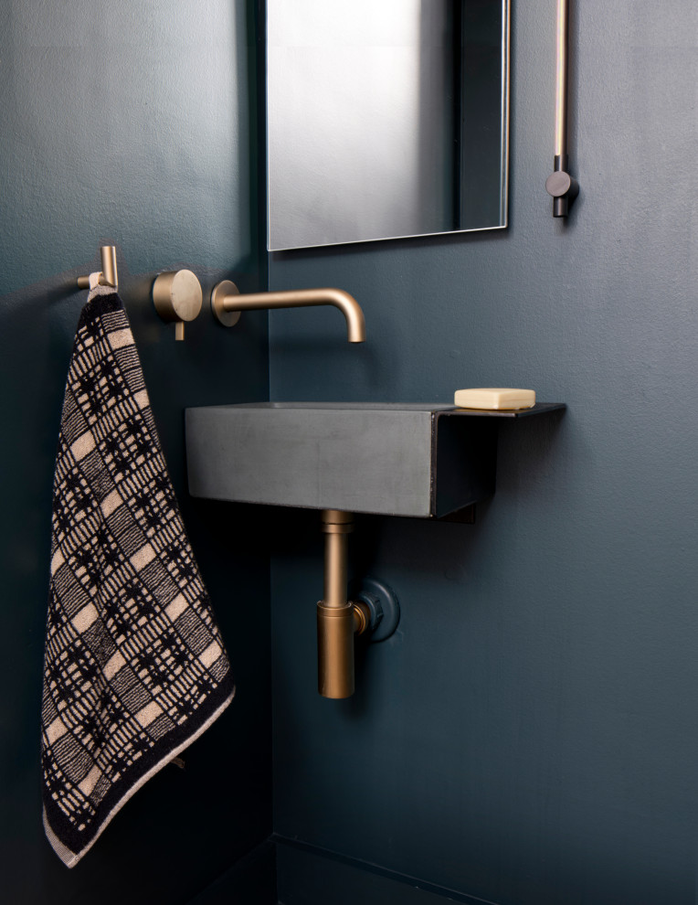 Small modern cloakroom in Philadelphia with a wall-mounted sink, concrete worktops and a floating vanity unit.